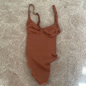 SKIMS body suit
